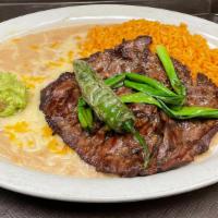 Carne Asada · Tender USDA choice steak grilled in a authentic Mexican style. Garnished with guacamole and ...