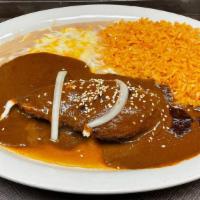Chicken Mole · Absolutely delicious. Chicken breast simmered in mama Tina's mole sauce.
