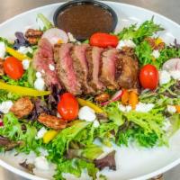 Steak Salad · Leafy Greens, Purple Onion, Sweet Bell Pepper, Tomato, Radish, Candied Pecans, Goat Cheese, ...