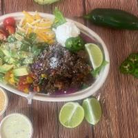 Taco Salad · Chopped Romaine, Purple Cabbage, Black Bean and Corn Salsa, Seasoned Ground Beef, Cheddar Ch...