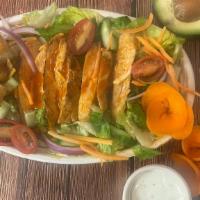 Buffalo Chicken Salad · Chopped Romaine, Leafy Green Mix, Celery, Cucumber, Carrot, Purple Onion, Crispy Fried, Onio...