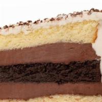 ** Black & White Fudge ** · Alternating layers of vanilla & chocolate cake, filled with our homemade chocolate fudge ici...