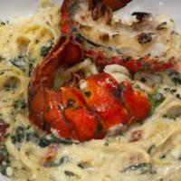 Lobster Shrimp Scampi · Lobster tail and jumbo shrimp simmered in Sloppy scampi sauce tossed with fresh spinach, sun...