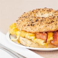 Meat & Egg & Cheese Sandwich · Two scrambled egg patties on your choice of freshly baked bagel, topped with your choice of ...