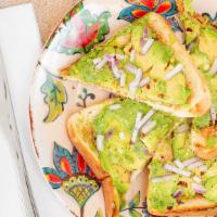 Bagel With Avocado · Fresh avocado with salt, pepper, lemon, and a few chili flakes