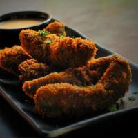 Avocado Fries · You read correctly! Slices of avocado lightly breaded and fried to perfection. Served with o...