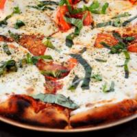 Margherita · Margherita sliced whole mozzarella, hot house tomatoes and basil make up this simple yet cla...