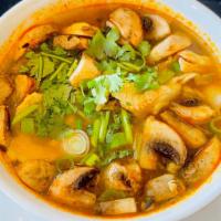 Tom Yum · Gluten-free. Mild spicy. Spicy lemongrass soup with mushroom and cilantro. **Contain Fish Sa...