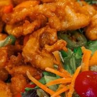 Basil Crispy Chicken · Mild spicy. Crispy chicken stir fried with chili peppers, onion and basil leaves in basil ga...