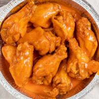 Buffalo Wings · Choice of wings style. served with celery and blue cheese or ranch dressing.