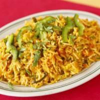 Vegetable Biryani · Basmati rice cooked with garden vegetables, spices, and yogurt.