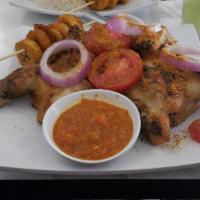 Whole Hen With Plantains · Whole Hen spiced to perfection grilled served with Plantains and spicy sauce.