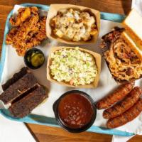 Picture Perfect · Serves 3-4 people a pound of pulled pork, five rib bones, three smoked sausages, five fresh ...