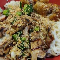 Fine Rice Vermicelli With Spring Rolls And Grilled Chicken Thigh (Bánh Hỏi Chả Giò Gà Nướng) · Contains nuts. Served with scallions, sliced cucumber, lettuce, mint leaves, and topped with...
