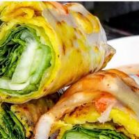 Banh Xeo Nime Chow · Vietnamese pancake wrapped with traditional mime chow with all the tasty filling. Served wit...