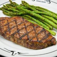 New York Strip · 12 oz. Served with a side & your choice of dinner Caesar salad, dinner salad (with a choice ...