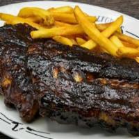 Bbq Pork Ribs · Slow-cooked & “fall-off-the-bone.” Served with a side & your choice of dinner Caesar salad, ...