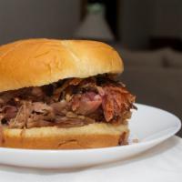Pulled Pork Sandwich · Delicious pulled pork slathered on fresh bread.