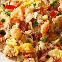 Young Chow Fried Rice · Served with chicken, shrimp, roast pork & egg.