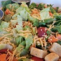 Chopped Salad · Chopped romaine lettuce mixed with cherry tomatoes, cucumber and carrots, topped with shredd...