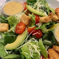 Green Goddess Caesar Salad · Chopped romaine lettuce mixed with cherry tomatoes and avocado, topped with shredded parmesa...