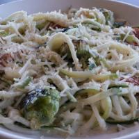 Zucchini Pasta · Roasted brussels sprouts, blistered cherry tomatoes, and a mix of garlic and herbs, served o...