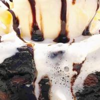 Brownie À La Mode · Chocolate fudge brownie topped with whipped cream, chocolate syrup, and vanilla bean ice cre...