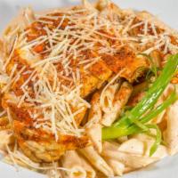 Blackened Chicken Pasta · Penne pasta tossed in a parmesan cream sauce with bell peppers, topped with blackened chicke...