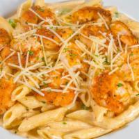 Cajun Shrimp Pasta · Penne pasta tossed in a parmesan cream sauce with bell peppers, topped with parmesan cheese.
