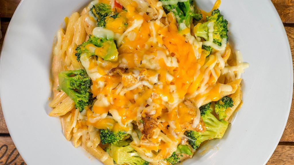 Chicken Broccoli Pasta · Penne pasta tossed in a parmesan cream sauce with broccoli and grilled chicken breast topped with cheddar cheese.