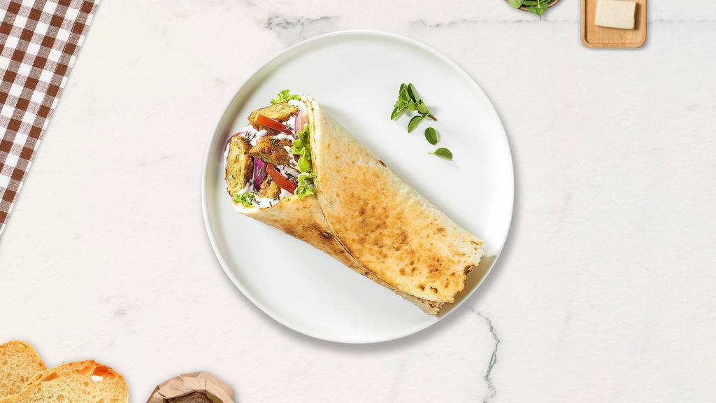 Falafel Munch · Homemade falafel, lettuce, tomato, cucumber, and hummus on Spanish wrap.