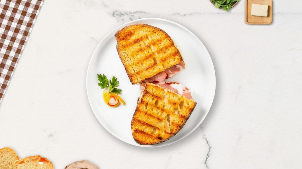 The Quirky Turkey · Fresh roast turkey, beef bacon, sun-dried tomatoes and fresh muenster on Greek pita.
