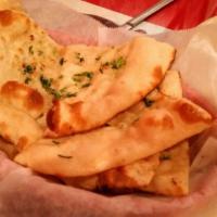 Garlic Naan · Most popular. Leavened bread baked with garlic.