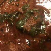 Lamb Curry · Cooked in curry sauce with spices.