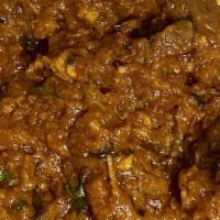 Goat Curry · Cooked in curry sauce with spices.