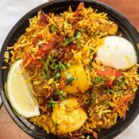 Madina Special Biryani · Jumbo shrimp, chicken, lamb and vegetable  with special spices and basmati rice.