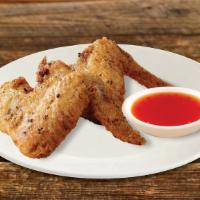Thai Chicken Wings (6) · Deep fried chicken wings marinated in Thai soy sauce, garlic, and white pepper.