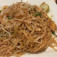 Phad Thai · Rice noodles stir fried with egg, tofu, bean sprouts, and green onion, topped with crushed p...