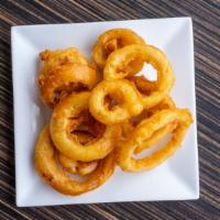 Onion Rings · Hand dipped beer-battered onion rings.