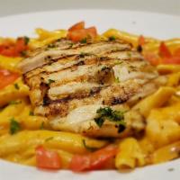 Cajun Fire Pasta · Your choice of grilled chicken or sautéed shrimp atop penne pasta with fresh tomatoes in a s...