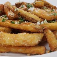 Truffle Fries · Our crunchy battered fries tossed with truffle, fresh parsley and Parmesan for your snacking...