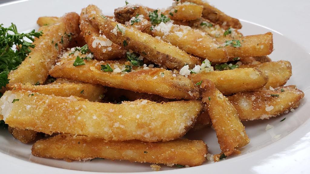 Truffle Fries · Our crunchy battered fries tossed with truffle, fresh parsley and Parmesan for your snacking delight.