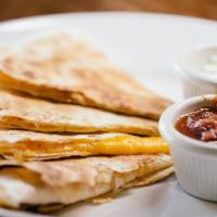 Quesadillas · 12” flour tortilla stuffed with cilantro, spices, cheddar and monterey jack cheese.