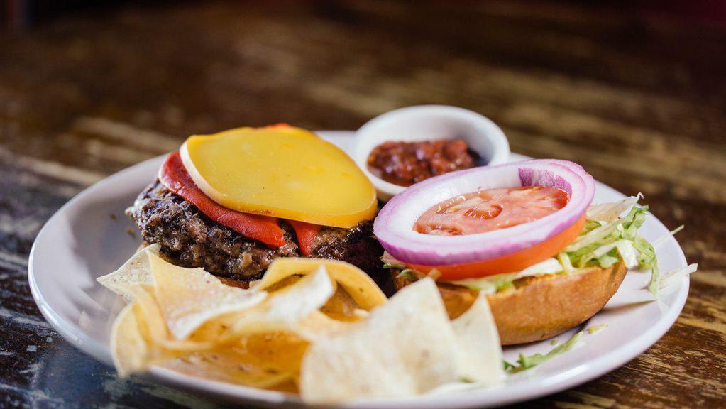 Red Bull Burger · Roasted red bell peppers, smoked gouda, and chipotle aioli. Served with lettuce, tomato, and onion on toasted ciabatta bun with a side of chips and salsa.