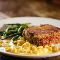 Veal And Mushroom Meatloaf · Griddled slice served with truffled white cheddar mac and cheese, and haricot vert.