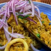 Arroz De Mariscos · “Seafood rice”. Marinated in our. seafood sauce, parmesan, filled with. calamari, shrimp, mu...