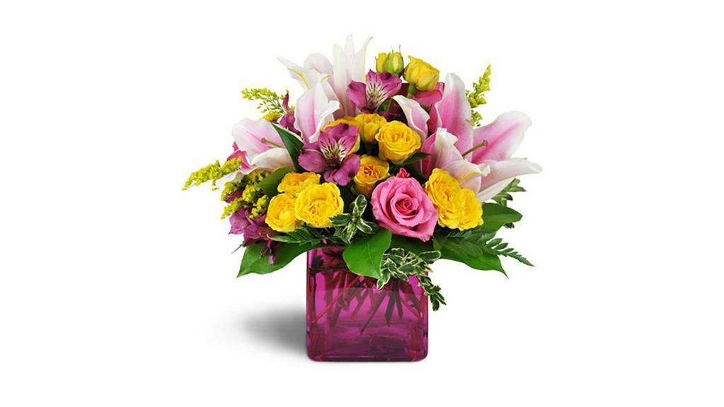 Stargazer Summer™ · It's the very definition of summertime chic! Bright pinks and yellow are a perfectly delightful gift for your special someone, for any occasion! 

Stargazer lilies are arranged with bright pink roses, yellow spray roses, and more in a modern pink glass vase.

Approximately 10