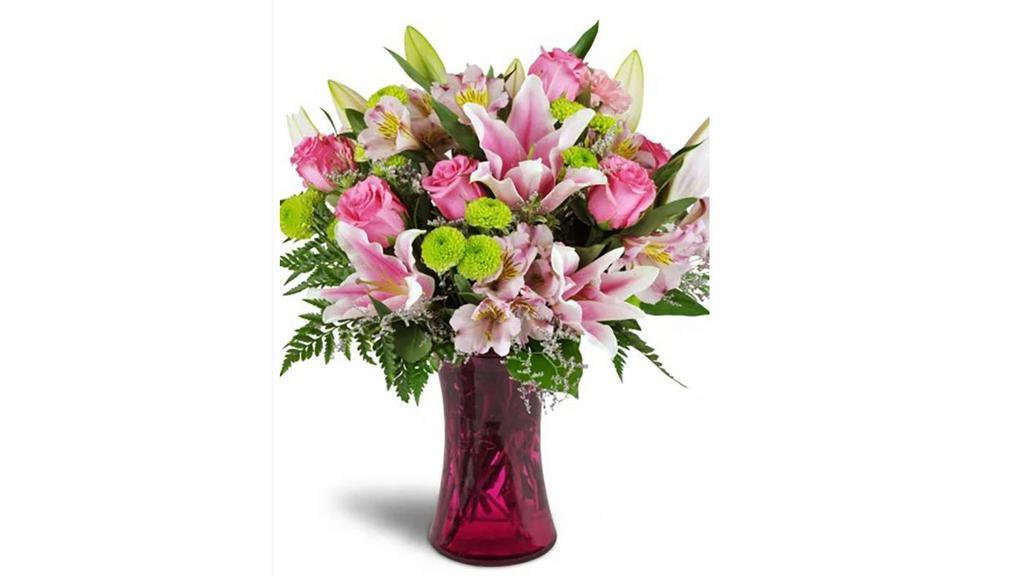 Perfectly Pink™ · Know someone who is simply perfect? Our Perfectly Pink™ bouquet is just the thing to send them your best wishes! Fun and modern, they'll be delighted to receive it!

Bright pink roses are cheerfully arranged with pink carnations and alstroemeria, plus lime green poms for a modern twist! A vivid pink glass vase completes the look.

Approximately 15