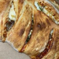 Italian Sausage Calzone · Italian sausage with onions, green pepper, pizza sauce and mozzarella cheese