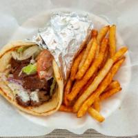 Greek Lamb & Beef Gyro · Served on pita bread with lettuce tomatoes onions tzatziki sauce and feta cheese.